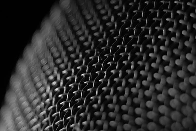 Intricate close-up of a wire mesh pattern showcasing texture and design.